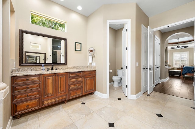 3533 SW 87th Dr, Gainesville, FL 32608 - ensuite bathroom with vanity, plenty of natural light, toilet, and baseboards