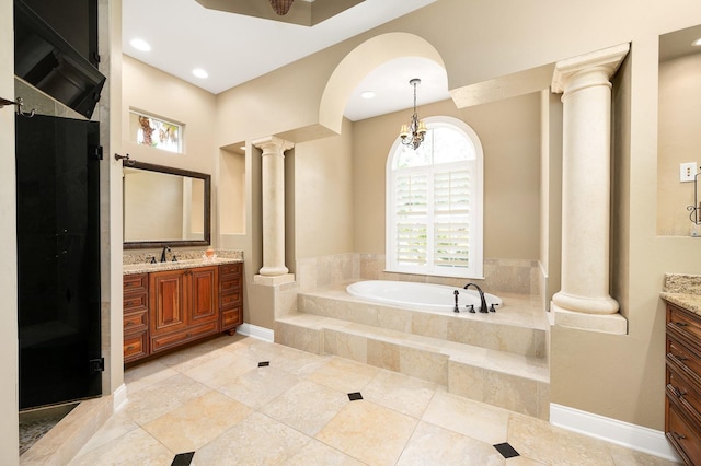 3533 SW 87th Dr, Gainesville, FL 32608 - bathroom featuring ornate columns, vanity, a garden tub, a shower, and recessed lighting