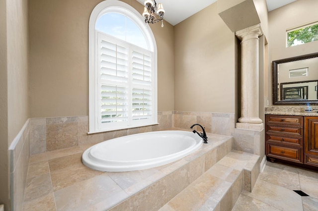 3533 SW 87th Dr, Gainesville, FL 32608 - full bathroom with vanity, a bath, a chandelier, and ornate columns