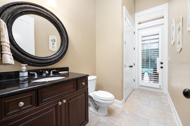 3533 SW 87th Dr, Gainesville, FL 32608 - half bath with toilet, vanity, and baseboards