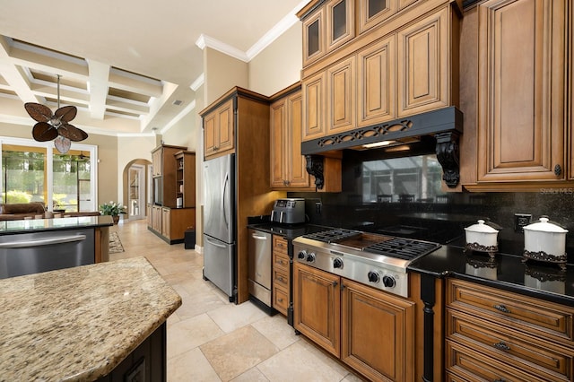 3533 SW 87th Dr, Gainesville, FL 32608 - kitchen with appliances with stainless steel finishes, arched walkways, coffered ceiling, tasteful backsplash, and a ceiling fan