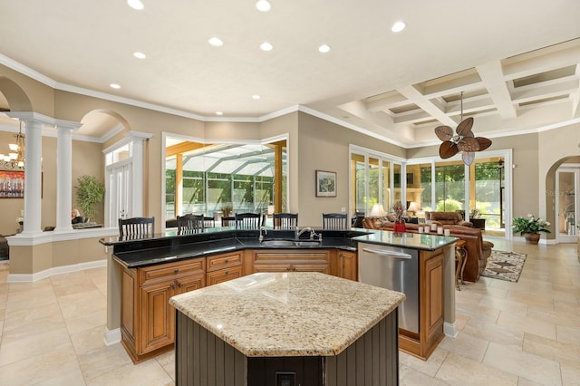 3533 SW 87th Dr, Gainesville, FL 32608 - kitchen featuring arched walkways, stainless steel dishwasher, a center island, ornate columns, and open floor plan