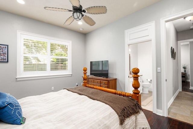 3533 SW 87th Dr, Gainesville, FL 32608 - bedroom with wood finished floors, ensuite bath, recessed lighting, and baseboards