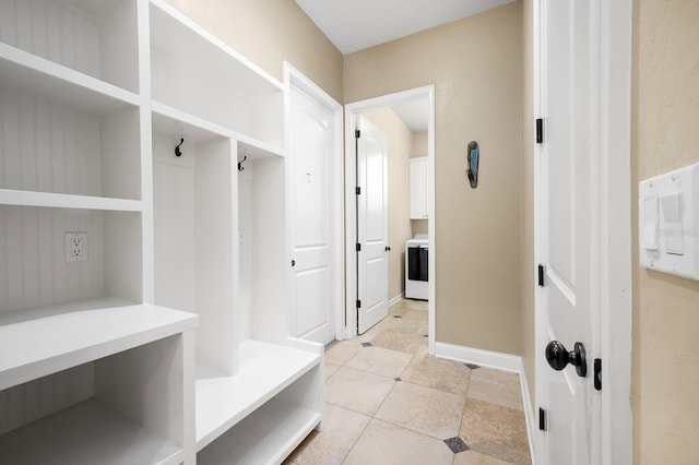 3533 SW 87th Dr, Gainesville, FL 32608 - mudroom featuring light tile patterned floors, washer / dryer, and baseboards