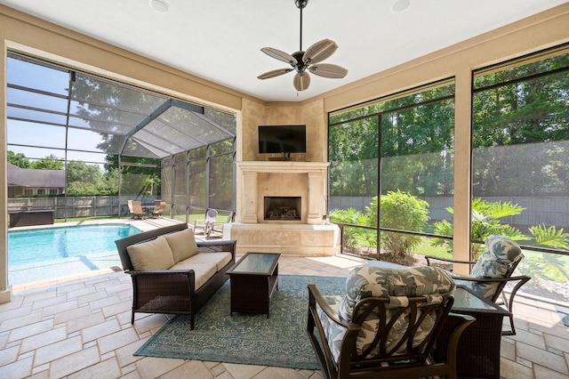 3533 SW 87th Dr, Gainesville, FL 32608 - sunroom with a ceiling fan, an outdoor living space with a fireplace, and a swimming pool