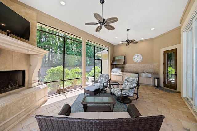 3533 SW 87th Dr, Gainesville, FL 32608 - sunroom with ceiling fan, exterior kitchen, an outdoor living space with a fireplace, and a sink