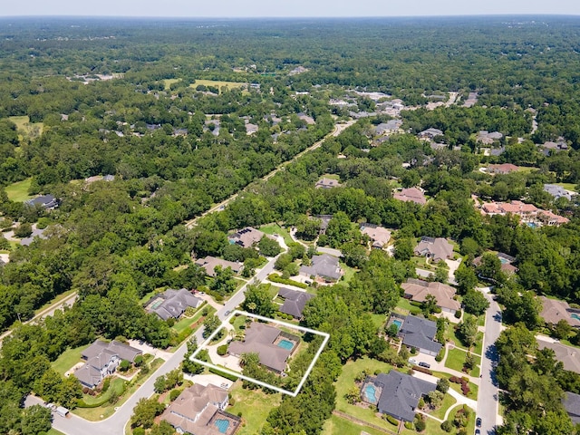 3533 SW 87th Dr, Gainesville, FL 32608 - aerial perspective of suburban area with property parcel outlined and a heavily wooded area