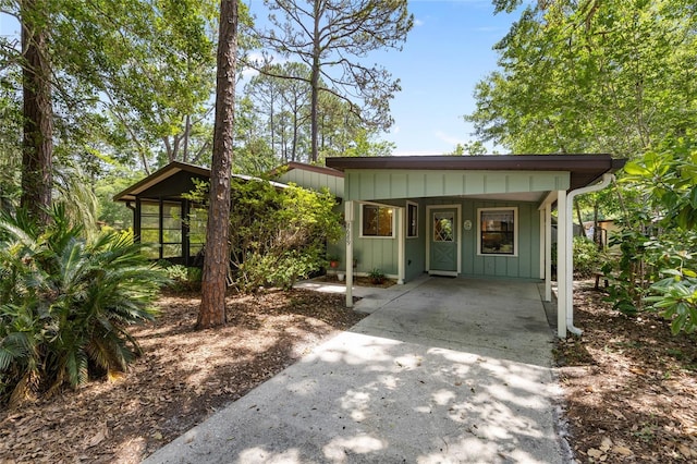 8689 NW 42nd Dr, Gainesville, FL 32653 - view of outdoor structure featuring concrete driveway