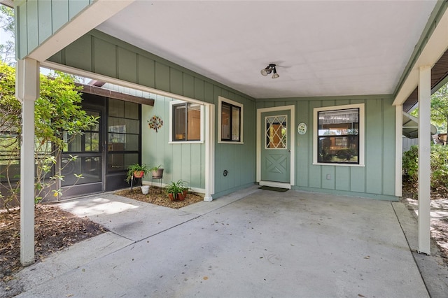 8689 NW 42nd Dr, Gainesville, FL 32653 - doorway to property featuring covered porch