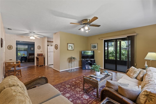 8689 NW 42nd Dr, Gainesville, FL 32653 - living area featuring ceiling fan and baseboards