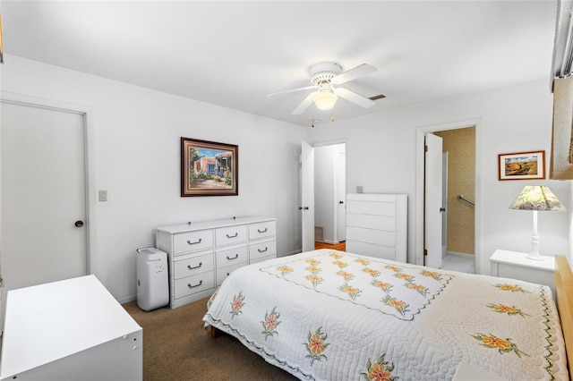 8689 NW 42nd Dr, Gainesville, FL 32653 - bedroom with dark colored carpet and ceiling fan