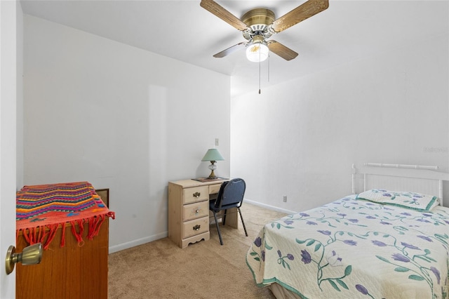 8689 NW 42nd Dr, Gainesville, FL 32653 - bedroom with light colored carpet, baseboards, and a ceiling fan