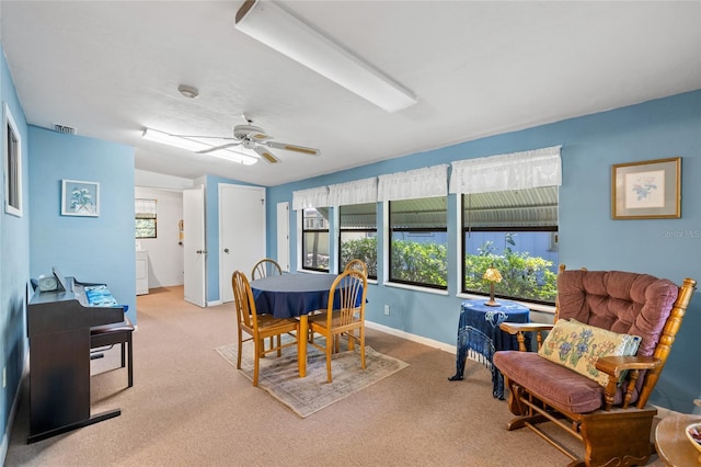 8689 NW 42nd Dr, Gainesville, FL 32653 - carpeted dining area with a ceiling fan and baseboards