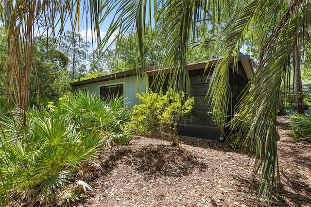 8689 NW 42nd Dr, Gainesville, FL 32653 - view of home's exterior with a sunroom