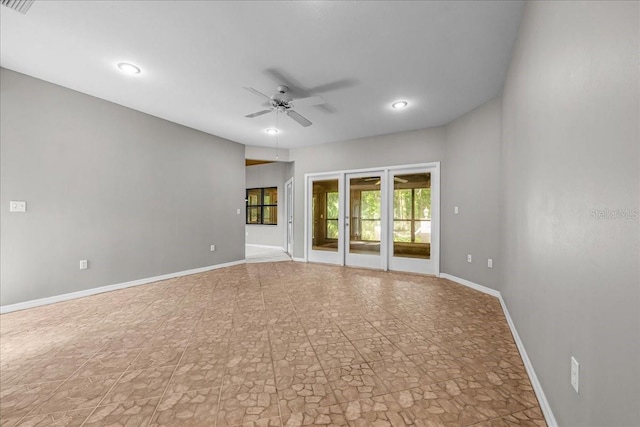 spare room with ceiling fan, baseboards, and recessed lighting