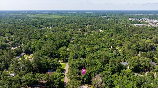 aerial view of property's location with a forest