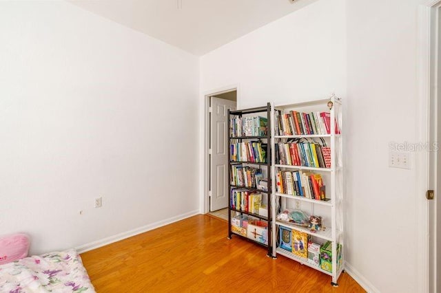 sitting room featuring wood finished floors and baseboards