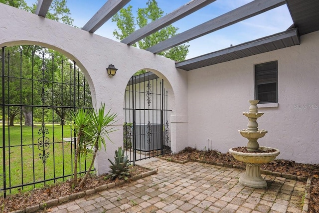 8804 NW 176th Ter, Alachua, FL 32615 - doorway to property with a gate and stucco siding