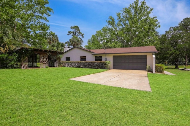 8804 NW 176th Ter, Alachua, FL 32615 - ranch-style house with an attached garage, stucco siding, a front yard, and driveway