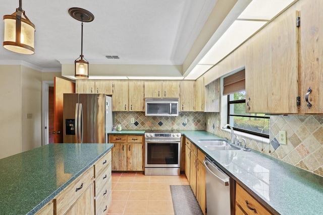 8804 NW 176th Ter, Alachua, FL 32615 - kitchen with appliances with stainless steel finishes, a sink, ornamental molding, tasteful backsplash, and decorative light fixtures