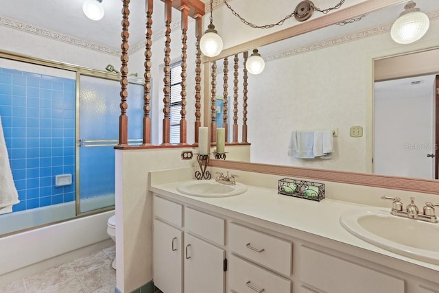 8804 NW 176th Ter, Alachua, FL 32615 - full bathroom featuring double vanity, toilet, and bath / shower combo with glass door