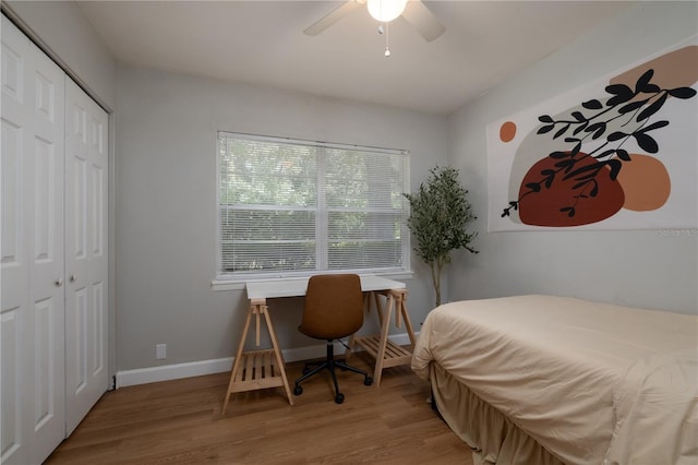 4502 SW 47th Way, Gainesville, FL 32608 - bedroom featuring wood finished floors, a closet, baseboards, and ceiling fan