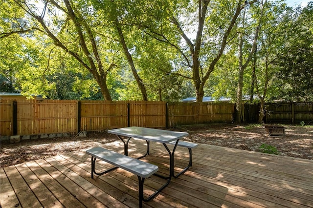 4502 SW 47th Way, Gainesville, FL 32608 - wooden deck with a fenced backyard and outdoor dining space