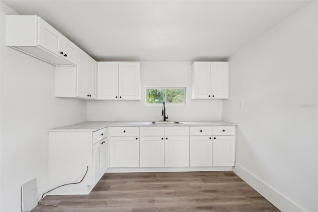 20014 SE 219th Ave, Hawthorne, FL 32640 - washroom featuring a sink, light wood-type flooring, and baseboards