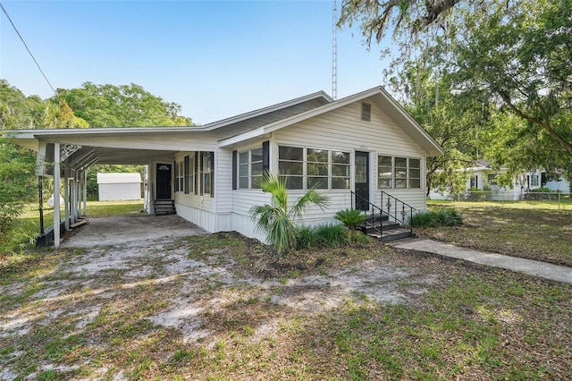 20014 SE 219th Ave, Hawthorne, FL 32640 - view of front of home with entry steps, an attached carport, and driveway