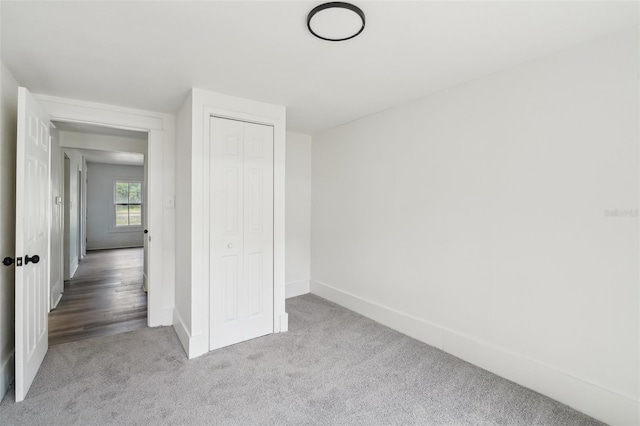 20014 SE 219th Ave, Hawthorne, FL 32640 - unfurnished bedroom with carpet floors, baseboards, and a closet