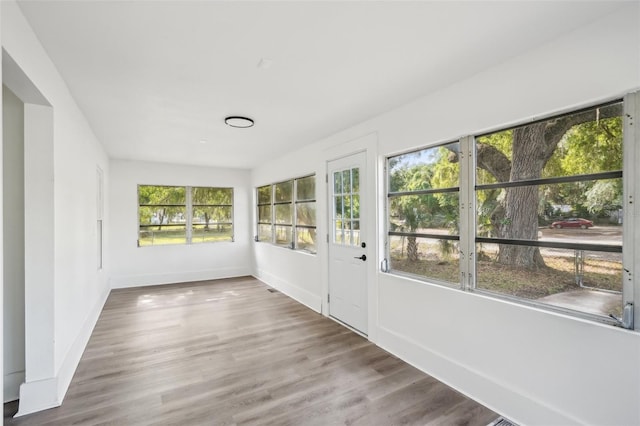 20014 SE 219th Ave, Hawthorne, FL 32640 - unfurnished sunroom featuring baseboards and wood finished floors