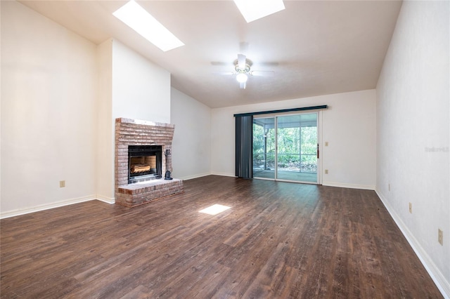 231 NW 48th Blvd Unit 0, Gainesville, FL 32607 - unfurnished living room featuring lofted ceiling, a skylight, a fireplace, dark wood-style flooring, and a ceiling fan