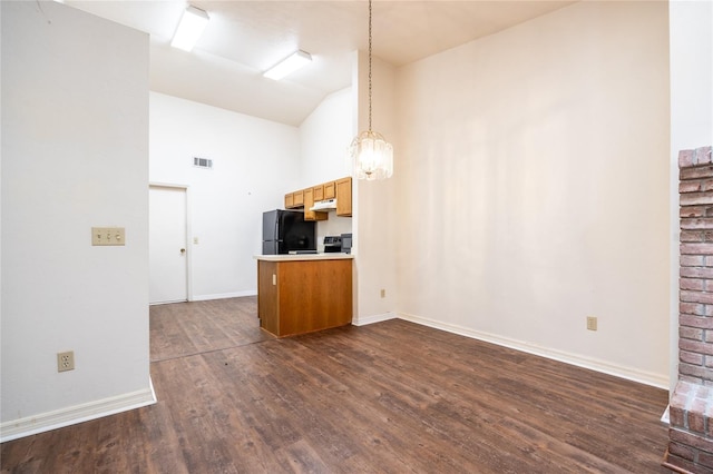 231 NW 48th Blvd Unit 0, Gainesville, FL 32607 - unfurnished living room featuring dark wood-style flooring, high vaulted ceiling, baseboards, and a chandelier