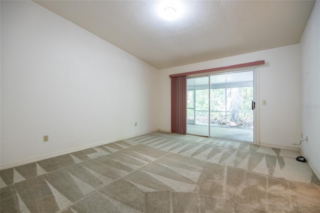231 NW 48th Blvd Unit 0, Gainesville, FL 32607 - unfurnished room with carpet flooring, lofted ceiling, and baseboards