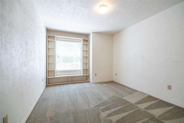 231 NW 48th Blvd Unit 0, Gainesville, FL 32607 - unfurnished room featuring carpet floors, baseboards, and a textured wall