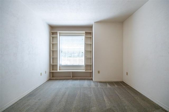 231 NW 48th Blvd Unit 0, Gainesville, FL 32607 - carpeted empty room with baseboards