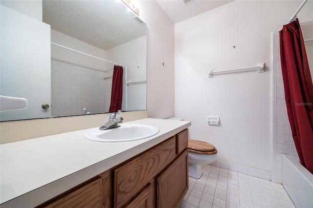231 NW 48th Blvd Unit 0, Gainesville, FL 32607 - full bath featuring tile patterned floors, toilet, vanity, shower / tub combo with curtain, and baseboards