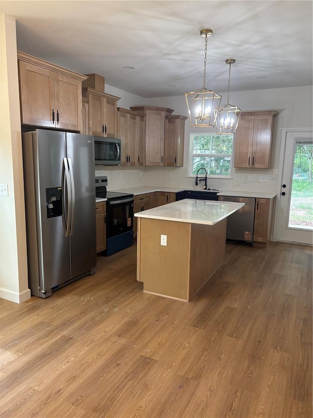 2522 SE 11th Ave, Gainesville, FL 32641 - kitchen featuring appliances with stainless steel finishes, light wood-style flooring, and healthy amount of natural light