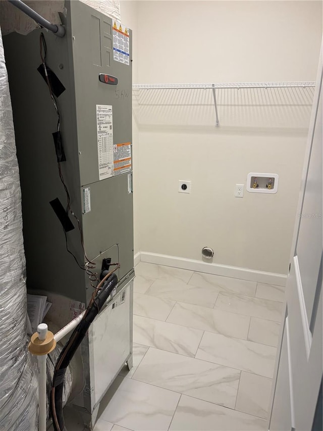 2522 SE 11th Ave, Gainesville, FL 32641 - washroom featuring electric dryer hookup, heating unit, marble finish floors, and washer hookup