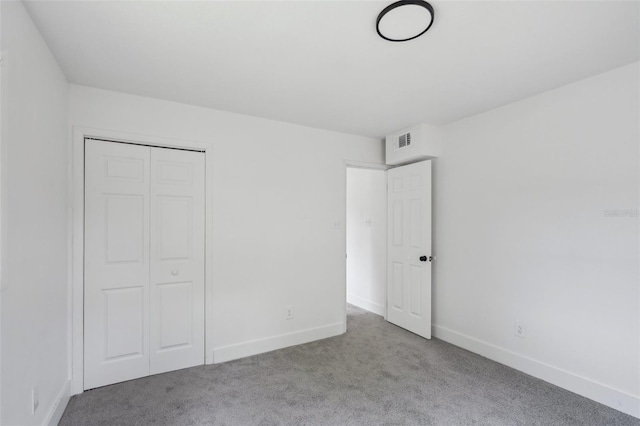 20016 SE 219th Ave, Hawthorne, FL 32640 - unfurnished bedroom with carpet, baseboards, and a closet