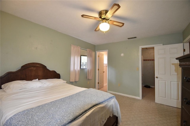 3425 NW 48th Ter, Gainesville, FL 32606 - bedroom featuring a walk in closet, light colored carpet, baseboards, ceiling fan, and a closet