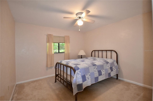 3425 NW 48th Ter, Gainesville, FL 32606 - bedroom featuring light carpet, baseboards, and ceiling fan