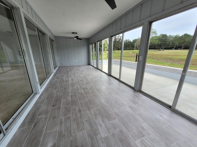 6015 SW 35th Way, Gainesville, FL 32608 - unfurnished sunroom featuring ceiling fan