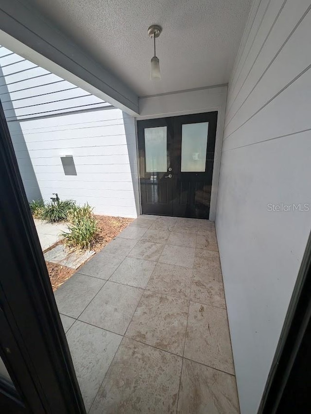 6015 SW 35th Way, Gainesville, FL 32608 - property entrance with french doors and a patio