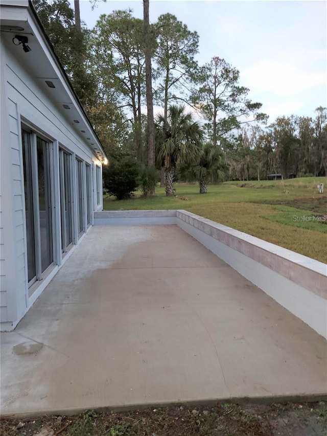 6015 SW 35th Way, Gainesville, FL 32608 - view of patio / terrace with view of scattered trees