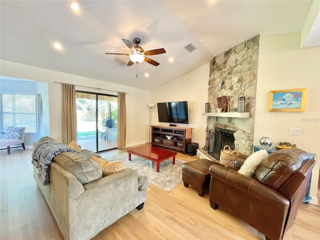 4370 NW 60th Ter, Gainesville, FL 32606 - living area featuring light wood-type flooring, a ceiling fan, lofted ceiling, a fireplace, and recessed lighting