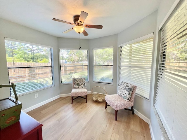 4370 NW 60th Ter, Gainesville, FL 32606 - sunroom featuring healthy amount of natural light, wood finished floors, and baseboards