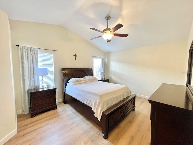4370 NW 60th Ter, Gainesville, FL 32606 - bedroom with vaulted ceiling, light wood-type flooring, a ceiling fan, and baseboards