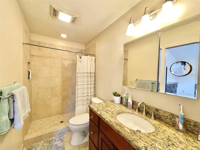 4370 NW 60th Ter, Gainesville, FL 32606 - bathroom featuring tiled shower, toilet, tile patterned flooring, and vanity
