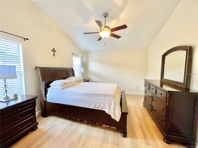 4370 NW 60th Ter, Gainesville, FL 32606 - bedroom with lofted ceiling, light wood-style flooring, baseboards, and ceiling fan
